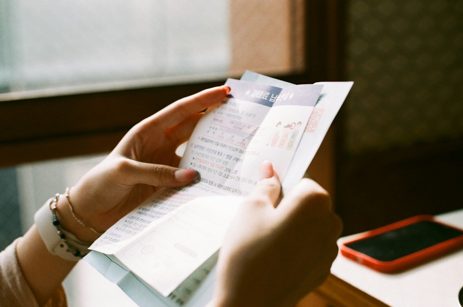 person holding Bills